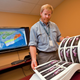 Sandy MacMullin with Nova Scotia’s offshore exploration atlas, the result of his quest.